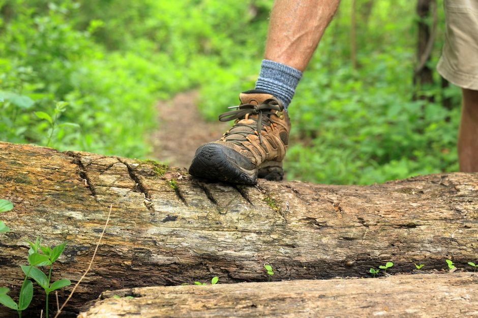 Hiking boots on a mountain trail representing active feet and bunion care